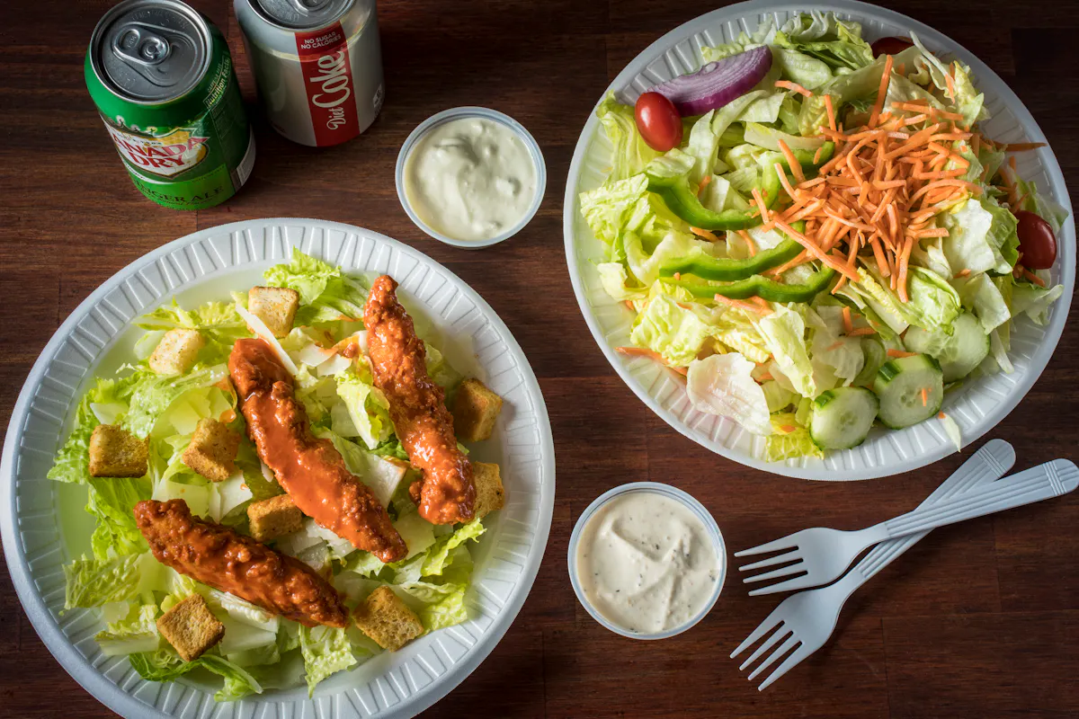 a bunch of food sitting on top of a wooden table